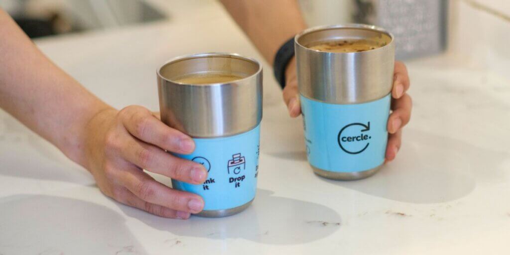 Two reusable Cercle cups filled with coffee.